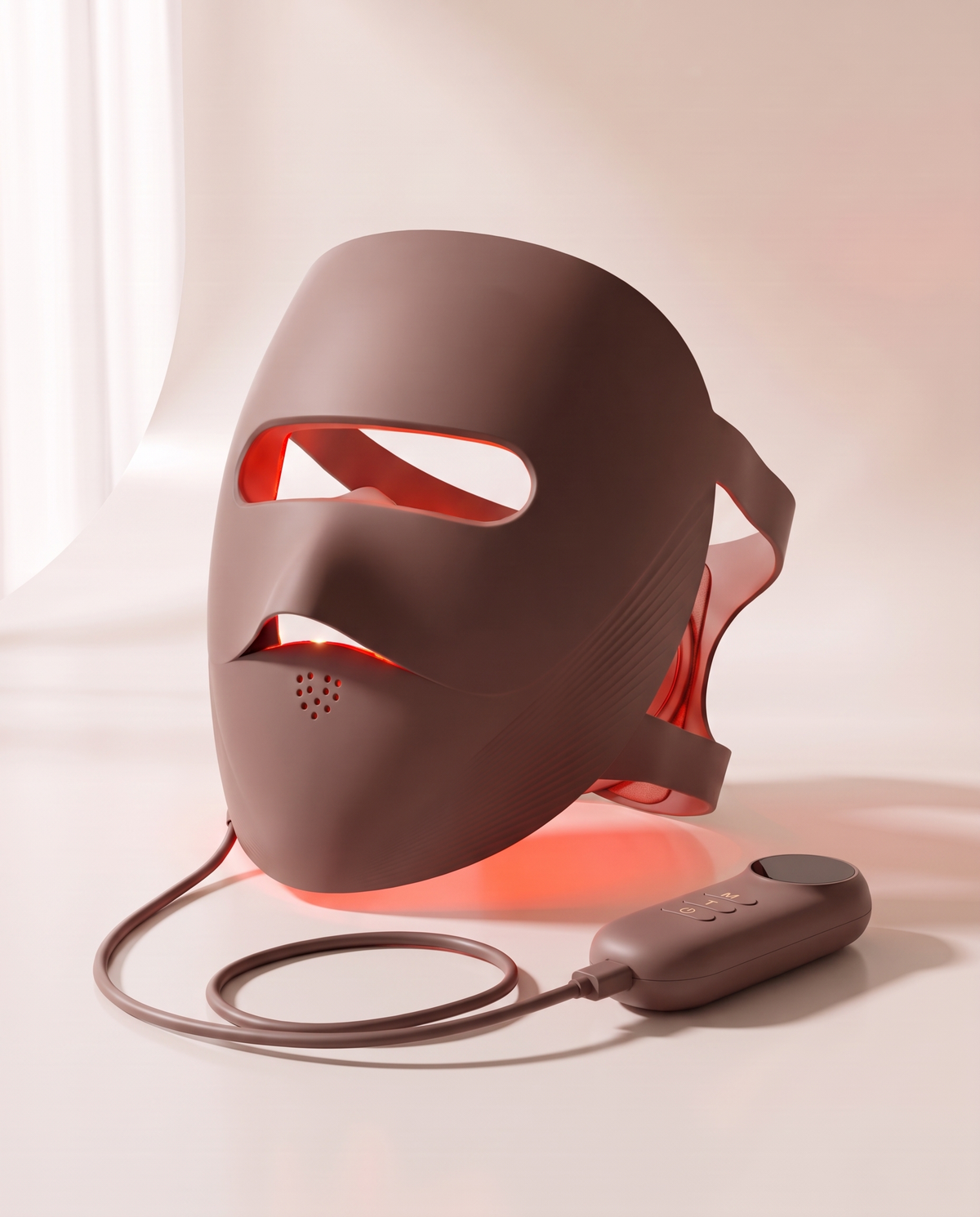 Clinaray LED light therapy mask in Brown with red light on, standing on a porcelain surface