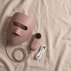 What is in the box: Clinaray mask in Brown, handheld controller and charging cable on linen